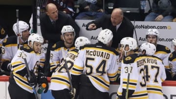 Oct 14, 2015; Denver, CO, USA; Boston Bruins head coach Claude Julien talks with his team during the third period against the Colorado Avalanche at Pepsi Center. The Bruins won 6-2. Mandatory Credit: Chris Humphreys-USA TODAY Sports