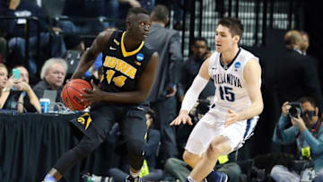 Mar 20, 2016; Brooklyn, NY, USA; Iowa Hawkeyes guard Peter Jok (14) controls the ball against Villanova Wildcats guard Ryan Arcidiacono (15) during the first half in the second round of the 2016 NCAA Tournament at Barclays Center. Mandatory Credit: Anthony Gruppuso-USA TODAY Sports