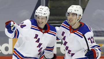 Jan 22, 2021; Pittsburgh, Pennsylvania, USA; New York Rangers right wing Kaapo Kakko (24) reacts with center Filip Chytil (72) after scoring a goal against Pittsburgh Penguins during the second period at the PPG Paints Arena. Mandatory Credit: Charles LeClaire-USA TODAY Sports
