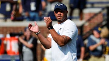 Michigan offensive coordinator Josh Gattis watches warmups before a game against Northern Illinois at Michigan Stadium in Ann Arbor on Saturday, Sept. 18, 2021.