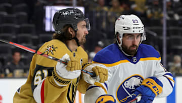 LAS VEGAS, NEVADA - FEBRUARY 01: Mark Stone #61 of the Vegas Golden Knights and Alex Tuch #89 of the Buffalo Sabres vie for the puck off a faceoff in the third period of their game at T-Mobile Arena on February 1, 2022 in Las Vegas, Nevada. The Golden Knights defeated the Sabres 5-2. (Photo by Ethan Miller/Getty Images)