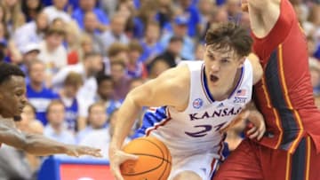 Kansas sophomore forward Zach Clemence (21) drives the ball through Pitt State during the second half of Thursday's game against Pitt State inside Allen Fieldhouse.