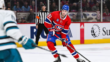 Nov 29, 2022; Montreal, Quebec, CAN; Montreal Canadiens center Sean Monahan (91) plays the puck against the San Jose Sharks during the second period at Bell Centre. Mandatory Credit: David Kirouac-USA TODAY Sports