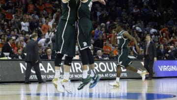 Mar 22, 2015; Charlotte, NC, USA; Michigan State Spartans forward Matt Costello (10) and guard Denzel Valentine (45) celebrates after the game against the Virginia Cavaliers in the third round of the 2015 NCAA Tournament at Time Warner Cable Arena. Mandatory Credit: Jeremy Brevard-USA TODAY Sports