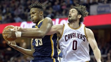 Feb 29, 2016; Cleveland, OH, USA; Indiana Pacers forward Myles Turner (33) rebounds beside Cleveland Cavaliers forward Kevin Love (0) in the first quarter at Quicken Loans Arena. Mandatory Credit: David Richard-USA TODAY Sports