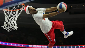 Dec 20, 2016; Philadelphia, PA, USA; A member of the Philadelphia 76ers flight squad wearing a holiday elf hat dunks between quarters against the New Orleans Pelicans at Wells Fargo Center. The Pelicans won 108-93. Mandatory Credit: Bill Streicher-USA TODAY Sports