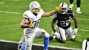 LAS VEGAS, NEVADA - DECEMBER 17: Hunter Henry #86 of the Los Angeles Chargers celebrates after scoring a 10 yard touchdown against the Las Vegas Raiders during the first half of the game at Allegiant Stadium on December 17, 2020 in Las Vegas, Nevada. (Photo by Chris Unger/Getty Images)