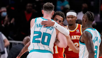 Nov 20, 2021; Atlanta, Georgia, USA; Atlanta Hawks guard Trae Young (11) hugs Charlotte Hornets forward Gordon Hayward (20) after the Hawks defeated the Hornets at State Farm Arena. Mandatory Credit: Dale Zanine-USA TODAY Sports