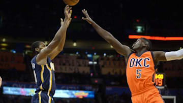 Nov 20, 2016; Oklahoma City, OK, USA; Indiana Pacers guard Glenn Robinson III (40) shoots the ball over Oklahoma City Thunder guard Victor Oladipo (5) during the second quarter at Chesapeake Energy Arena. Mandatory Credit: Mark D. Smith-USA TODAY Sports