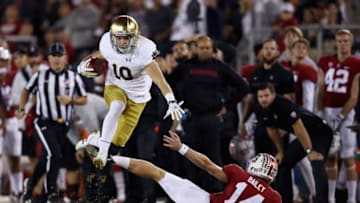PALO ALTO, CA - NOVEMBER 25: Chris Finke #10 of the Notre Dame Fighting Irish jumps over Jake Bailey #14 of the Stanford Cardinal on a punt return at Stanford Stadium on November 25, 2017 in Palo Alto, California. (Photo by Ezra Shaw/Getty Images)