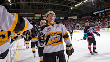 KELOWNA, BC - NOVEMBER 03: Braden Schneider #2 of the Brandon Wheat Kings skates along the bench to celebrate a goal against the Kelowna Rockets at Prospera Place on November 3, 2018 in Kelowna, Canada. (Photo by Marissa Baecker/Getty Images)