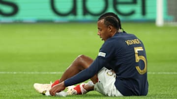 PARIS, FRANCE - SEPTEMBER 22: Jules Kounde #5 of Team France reacts after his injury the UEFA Nations League League A Group 1 match between France and Austria at on September 22, 2022 in Paris, France. (Photo by Xavier Laine/Getty Images)