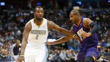 Feb 18, 2014; Denver, CO, USA; Denver Nuggets guard Jordan Hamilton (1) drives to the basket during the first half against the Phoenix Suns at Pepsi Center. Mandatory Credit: Chris Humphreys-USA TODAY Sports