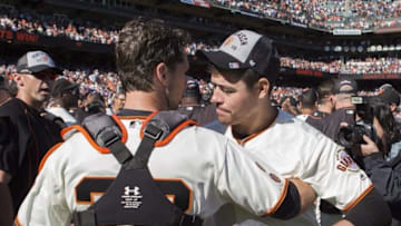 Oct 2, 2016; San Francisco, CA, USA; San Francisco Giants starting pitcher Matt Moore (45) and catcher Buster Posey (28) celebrate cinching the wild card against the Los Angeles Dodgers at AT&T Park the San Francisco Giants defeated the Los Angeles Dodgers 7 to 1. Mandatory Credit: Neville E. Guard-USA TODAY Sports