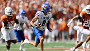 AUSTIN, TEXAS - SEPTEMBER 30: Jason Bean #9 of the Kansas Jayhawks scrambles in the first half against the Texas Longhorns at Darrell K Royal-Texas Memorial Stadium on September 30, 2023 in Austin, Texas. (Photo by Tim Warner/Getty Images)