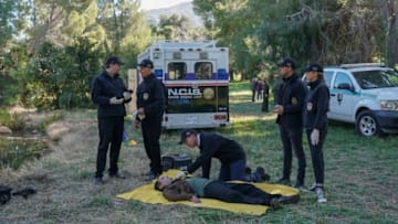 "Schooled" -- The team searches for answers when the body of a well-regarded Navy technician in the Reserves is found floating in a lake where a popular community event is being held. Also, Sloane is caught off-guard when her daughter, Faith (Kate Hamilton), makes an unexpected request, on NCIS, Tuesday, March 24 (8:00-9:00 PM, ET/PT) on the CBS Television Network. Pictured: Sean Murray as NCIS Special Agent Timothy McGee, Mark Harmon as NCIS Special Agent Leroy Jethro Gibbs, Brian Dietzen as Medical Examiner Jimmy Palmer, Wilmer Valderrama as NCIS Special Agent Nicholas "Nick" Torres, Emily Wickersham as NCIS Special Agent Eleanor "Ellie" Bishop. Photo: Sonja Flemming/CBS ©2020 CBS Broadcasting, Inc. All Rights Reserved.