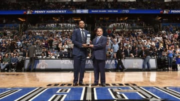 ORLANDO, FL - JANUARY 20: Anfernee 'Penny" Hardaway is presented with an award by Alex Martins for being inducted into the Orlando magic's team hall of fame on January 20, 2017 at Amway Center in Orlando, Florida. NOTE TO USER: User expressly acknowledges and agrees that, by downloading and or using this photograph, User is consenting to the terms and conditions of the Getty Images License Agreement. Mandatory Copyright Notice: Copyright 2017 NBAE (Photo by Fernando Medina/NBAE via Getty Images)