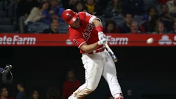 ANAHEIM, CA - MAY 19: Mike Trout #27 of the Los Angeles Angels of Anaheim hits a two-run homerun in the ninth inning during the MLB game against the Tampa Bay Rays at Angel Stadium on May 19, 2018 in Anaheim, California. The Rays defeated the Angels 5-3. (Photo by Victor Decolongon/Getty Images)
