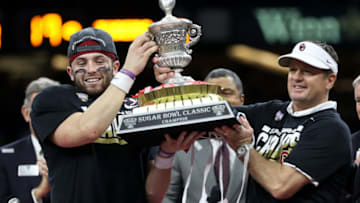 NEW ORLEANS, LA - JANUARY 02: Head coach Bob Stoops and Baker Mayfield #6 of the Oklahoma Sooners hold the winner's trophy after defeating the Auburn Tigers 35-19 during the Allstate Sugar Bowl at the Mercedes-Benz Superdome on January 2, 2017 in New Orleans, Louisiana. (Photo by Matthew Stockman/Getty Images)