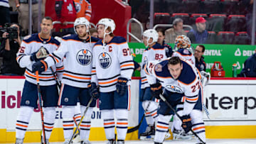 DETROIT, MI - NOVEMBER 03: Darnell Nurse #25, Leon Draisaitl #29, Connor McDavid #97 and Milan Lucic #27 of the Edmonton Oilers skates in warm-ups prior to an NHL game against the Detroit Red Wings at Little Caesars Arena on November 3, 2018 in Detroit, Michigan. The Oilers defeated the Wings 4-3. (Photo by Dave Reginek/NHLI via Getty Images)