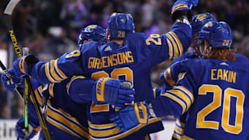 Mar 23, 2022; Buffalo, New York, USA; Buffalo Sabres left wing Zemgus Girgensons (28) celebrates his goal with teammates during the second period against the Pittsburgh Penguins at KeyBank Center. Mandatory Credit: Timothy T. Ludwig-USA TODAY Sports