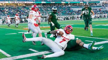 Nov 25, 2022; Fort Collins, Colorado, USA; New Mexico Lobos quarterback CJ Montes (7) pushed out of bounds for a loss of yardage at Sonny Lubick Field at Canvas Stadium. Mandatory Credit: Michael Madrid-USA TODAY Sports