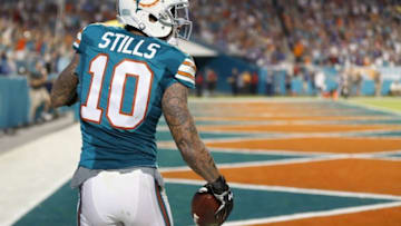 Dec 14, 2015; Miami Gardens, FL, USA; Miami Dolphins wide receiver Kenny Stills (10) celebrates his touchdown catch during the second half against the New York Giants at Sun Life Stadium. Mandatory Credit: Steve Mitchell-USA TODAY Sports