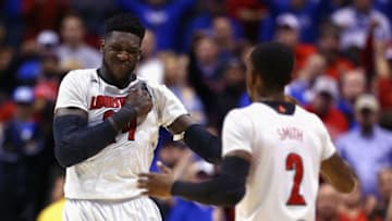 INDIANAPOLIS, IN - MARCH 28: Montrezl Harrell #24 of the Louisville Cardinals celebrates with teammate Russ Smith #2 after a basket against the Kentucky Wildcats during the regional semifinal of the 2014 NCAA Men's Basketball Tournament at Lucas Oil Stadium on March 28, 2014 in Indianapolis, Indiana. (Photo by Andy Lyons/Getty Images)