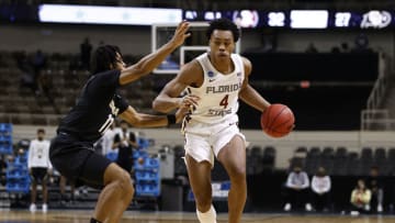 INDIANAPOLIS, INDIANA - MARCH 22: Scottie Barnes #4 of the Florida State Seminoles drives the ball as Keeshawn Barthelemy #11 of the Colorado Buffaloes during the second half in the second round game of the 2021 NCAA Men's Basketball Tournament at Indiana Farmers Coliseum on March 22, 2021 in Indianapolis, Indiana. (Photo by Maddie Meyer/Getty Images)