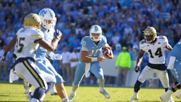 Nov 5, 2016; Chapel Hill, NC, USA; North Carolina Tar Heels quarterback Mitch Trubisky (10) runs for his forth quarter touchdown run against the Georgia Tech Yellow Jackets at Kenan Memorial Stadium. The North Carolina Tar Heels defeated the Georgia Tech Yellow Jackets 48-20. Mandatory Credit: James Guillory-USA TODAY Sports
