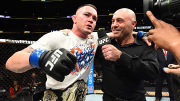 CHICAGO, ILLINOIS - JUNE 09: Colby Covington is interviewed by Joe Rogan after defeating Rafael Dos Anjos of Brazil in their interim welterweight title fight during the UFC 225 event at the United Center on June 9, 2018 in Chicago, Illinois. (Photo by Josh Hedges/Zuffa LLC/Zuffa LLC via Getty Images)