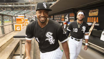 CHICAGO - SEPTEMBER 11: Eloy Jimenez #74 and Yoan Moncada #10 of the Chicago White Sox look on from the dugout prior to the game against the Kansas City Royals on September 11, 2019 at Guaranteed Rate Field in Chicago, Illinois. (Photo by Ron Vesely/MLB Photos via Getty Images)