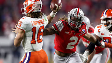 GLENDALE, ARIZONA - DECEMBER 28: Chase Young #2 of the Ohio State Buckeyes pursues Trevor Lawrence #16 of the Clemson Tigers in the first half during the College Football Playoff Semifinal at the PlayStation Fiesta Bowl at State Farm Stadium on December 28, 2019 in Glendale, Arizona. (Photo by Matthew Stockman/Getty Images)