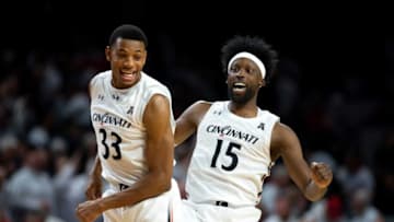 Cincinnati Bearcats forward Ody Oguama celebrates with Cincinnati Bearcats forward John Newman III. The Enquirer.