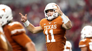 ARLINGTON, TEXAS - DECEMBER 01: Sam Ehlinger #11 of the Texas Longhorns celebrates his touchdown run against the Oklahoma Sooners in the first quarter at AT&T Stadium on December 01, 2018 in Arlington, Texas. (Photo by Ronald Martinez/Getty Images)