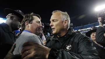 Nov 1, 2014; Jacksonville, FL, USA; Florida Gators head coach Will Muschamp and Georgia Bulldogs head coach Mark Richt greet after the game at EverBank Field. Florida Gators defeated the Georgia Bulldogs 38-20. Mandatory Credit: Kim Klement-USA TODAY Sports