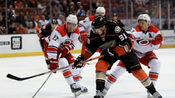 ANAHEIM, CA - DECEMBER 07: Jakob Silfverberg #33 of the Anaheim Ducks skates through the defense of Brett Pesce #22, and Jeff Skinner #53 of the Carolina Hurricanes during the third period of a game at Honda Center on December 7, 2016 in Anaheim, California. (Photo by Sean M. Haffey/Getty Images)