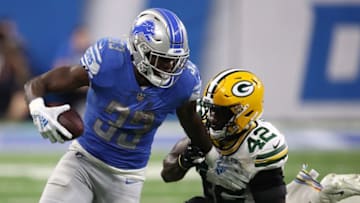 DETROIT, MI - OCTOBER 07: Kerryon Johnson #33 of the Detroit Lions runs for yardage against Oren Burks #42 of the Green Bay Packers during the second half at Ford Field on October 7, 2018 in Detroit, Michigan. (Photo by Gregory Shamus/Getty Images)