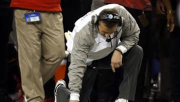 Jan 12, 2015; Arlington, TX, USA; Ohio State Buckeyes head coach Urban Meyer kneels on the filed during the fourth quarter against the Oregon Ducks in the 2015 CFP National Championship Game at AT&T Stadium. Mandatory Credit: Tim Heitman-USA TODAY Sports