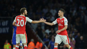 LONDON, ENGLAND - SEPTEMBER 24: (L-R) Shkodran Mustafi and Laurent Koscielny of Arsenal during the Premier League match between Arsenal and Chelsea at Emirates Stadium on September 24, 2016 in London, England. (Photo by Stuart MacFarlane/Arsenal FC via Getty Images)