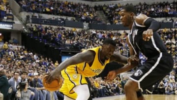 Feb 1, 2014; Indianapolis, IN, USA; Indiana Pacers guard Lance Stephenson (1) drives to the basket against Brooklyn Nets guard Joe Johnson (7) at Bankers Life Fieldhouse. Indiana defeats Brooklyn 97-96. Mandatory Credit: Brian Spurlock-USA TODAY Sports