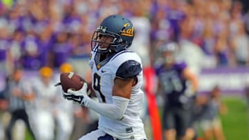Aug 30, 2014; Evanston, IL, USA; California Golden Bears wide receiver Trevor Davis (9) catches a 76 yards touchdown pass from quarterback Jared Goff (not pictured) during the first half against the Northwestern Wildcats at Ryan Field. Mandatory Credit: Dennis Wierzbicki-USA TODAY Sports