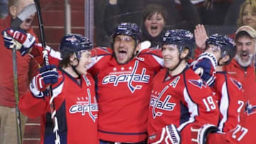 Jan 10, 2016; Washington, DC, USA; Washington Capitals left wing Alex Ovechkin (8) is surrounded by teammates right wing T.J. Oshie (77), center Nicklas Backstrom (19), defenseman Matt Niskanen (2) and defenseman Karl Alzner (27) against the Ottawa Senators during the third period at Verizon Center. Mandatory Credit: Rafael Suanes-USA TODAY Sports