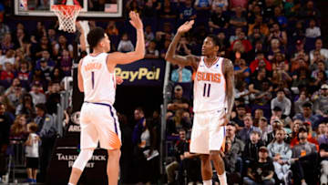 PHOENIX, AZ - MARCH 27: Devin Booker #1 of the Phoenix Suns high-fovea Jamal Crawford #11 of the Phoenix Suns against the Washington Wizards on March 27, 2019 at Talking Stick Resort Arena in Phoenix, Arizona. NOTE TO USER: User expressly acknowledges and agrees that, by downloading and or using this photograph, user is consenting to the terms and conditions of the Getty Images License Agreement. Mandatory Copyright Notice: Copyright 2019 NBAE (Photo by Barry Gossage/NBAE via Getty Images)