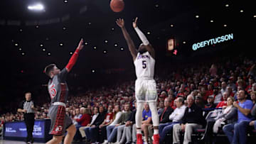 TUCSON, ARIZONA - JANUARY 16: Max Hazzard #5 of the Arizona Wildcats attempts a three point shot over Rylan Jones #15 of the Utah Utes during the first half of the NCAA men's basketball game at McKale Center on January 16, 2020 in Tucson, Arizona. (Photo by Christian Petersen/Getty Images)