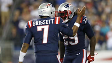 Sep 22, 2016; Foxborough, MA, USA; New England Patriots running back LeGarrette Blount (29) celebrates with quarterback Jacoby Brissett (7) after a touchdown during the fourth quarter against the Houston Texans at Gillette Stadium. The Patriots won 27-0. Mandatory Credit: Greg M. Cooper-USA TODAY Sports