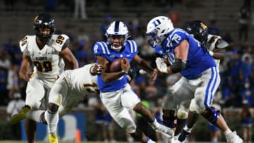 Sep 10, 2021; Durham, North Carolina, USA; Duke Blue Devils quarterback Jordan Moore (8) runs against the North Carolina A&T Aggies during the fourth quarter at Wallace Wade Stadium. Mandatory Credit: William Howard-USA TODAY Sports