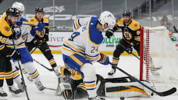 BOSTON, MA - APRIL 13: Jeremy Swayman #1 of the Boston Bruins blocks a shot from Dylan Cozens #24 of the Buffalo Sabres during the second period of a game at TD Garden on April 13, 2021 in Boston, Massachusetts. (Photo by Adam Glanzman/Getty Images)