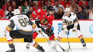 CHICAGO, IL - JANUARY 12: Patrick Kane #88 of the Chicago Blackhawks and Brayden McNabb #3 of the Vegas Golden Knights battle for the puck in the second period at the United Center on January 12, 2019 in Chicago, Illinois. (Photo by Chase Agnello-Dean/NHLI via Getty Images)