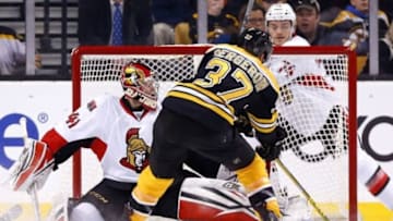 Dec 29, 2015; Boston, MA, USA; Boston Bruins center Patrice Bergeron (37) scores a goal past Ottawa Senators goalie Craig Anderson (41) during the first period at TD Garden. Mandatory Credit: Winslow Townson-USA TODAY Sports